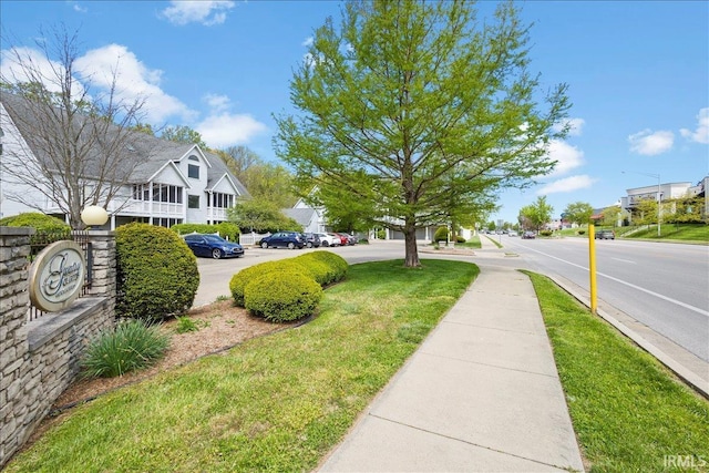 exterior space featuring sidewalks and a residential view