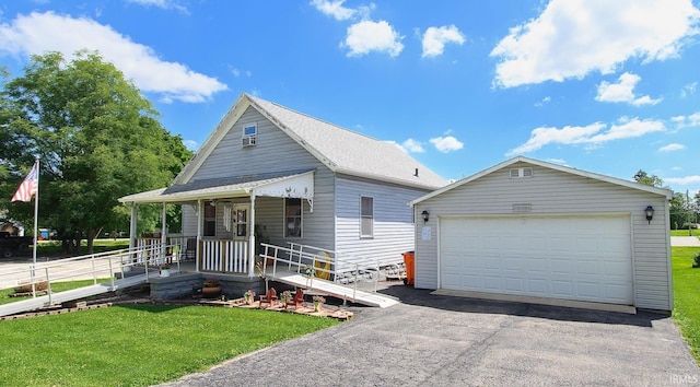 view of front of property with a garage, a front yard, covered porch, and an outdoor structure