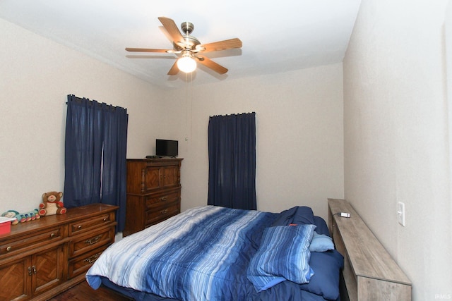 bedroom with ceiling fan and wood finished floors