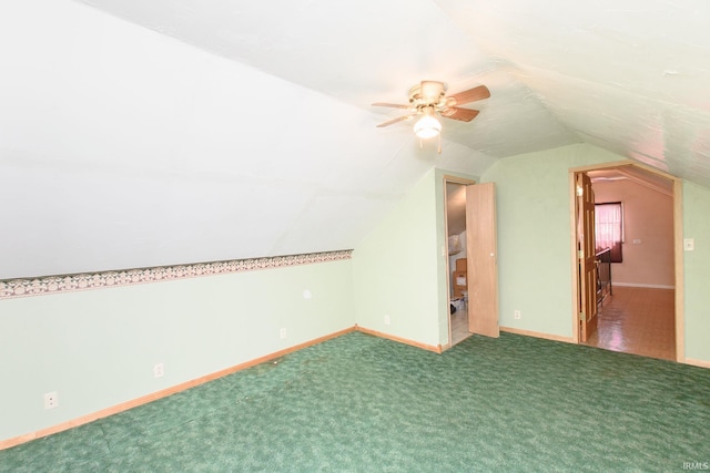additional living space with lofted ceiling, a ceiling fan, carpet flooring, and baseboards