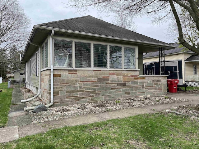 view of home's exterior featuring a shingled roof