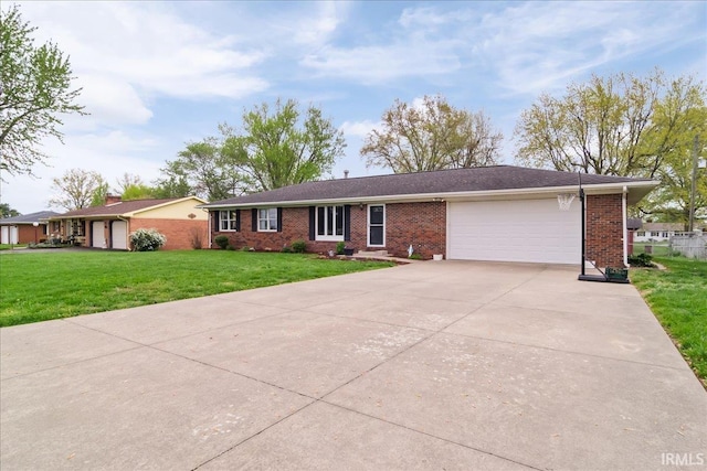 single story home with brick siding, an attached garage, a front yard, and concrete driveway