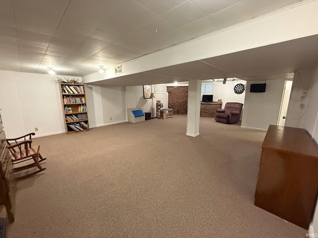 finished basement with baseboards and carpet flooring