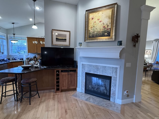 3201 E Kristen Ct, Bloomington, IN 47401 - interior space featuring a fireplace, light wood-style flooring, lofted ceiling, and recessed lighting