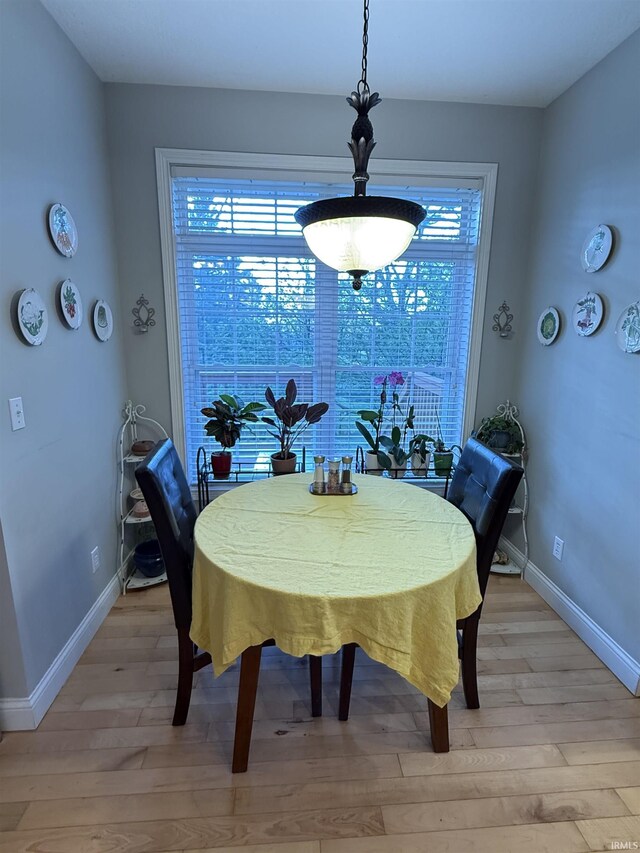 3201 E Kristen Ct, Bloomington, IN 47401 - dining room featuring baseboards and light wood-style floors