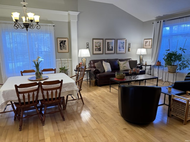 3201 E Kristen Ct, Bloomington, IN 47401 - dining area featuring an inviting chandelier, lofted ceiling, and light wood-style flooring