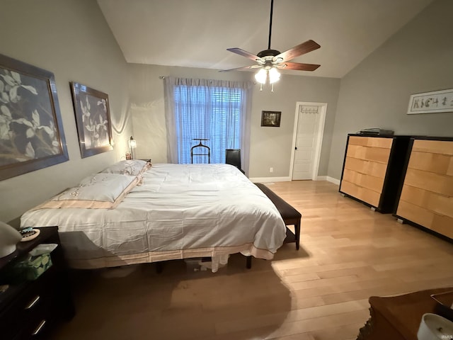 3201 E Kristen Ct, Bloomington, IN 47401 - bedroom featuring light wood finished floors, vaulted ceiling, baseboards, and ceiling fan