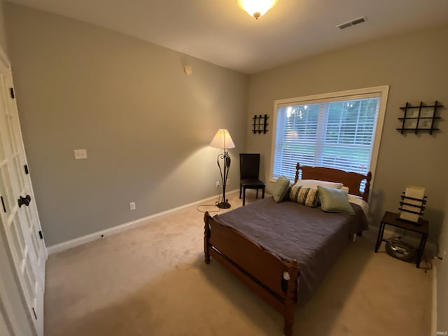 3201 E Kristen Ct, Bloomington, IN 47401 - bedroom featuring light carpet, baseboards, and visible vents