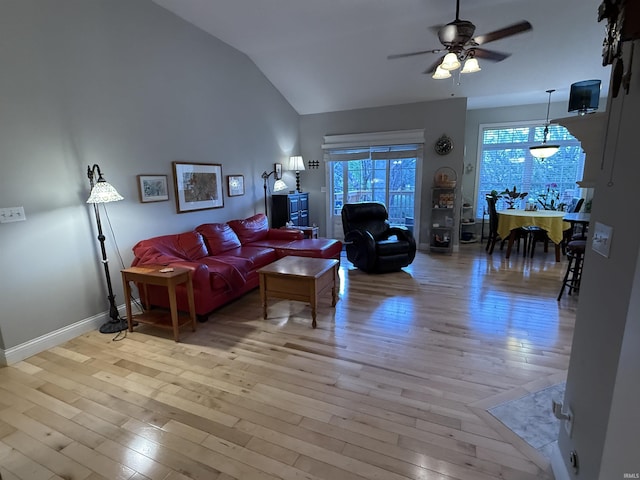 3201 E Kristen Ct, Bloomington, IN 47401 - living room with ceiling fan, lofted ceiling, baseboards, and light wood-style flooring
