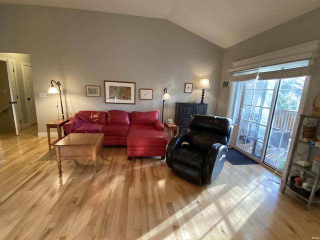 3201 E Kristen Ct, Bloomington, IN 47401 - living room featuring vaulted ceiling and light wood-style flooring