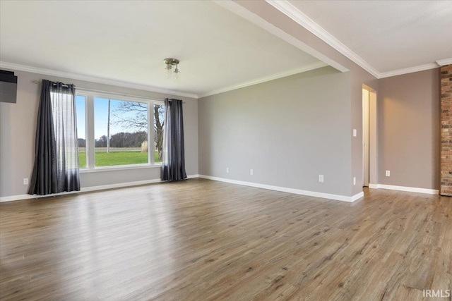 1689 E 550 Rd S, Peru, IN 46970 - unfurnished room with baseboards, wood finished floors, and ornamental molding