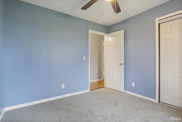 1689 E 550 Rd S, Peru, IN 46970 - unfurnished bedroom featuring baseboards, a ceiling fan, and carpet flooring