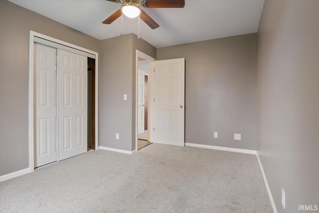 1689 E 550 Rd S, Peru, IN 46970 - unfurnished bedroom featuring carpet, a closet, baseboards, and ceiling fan