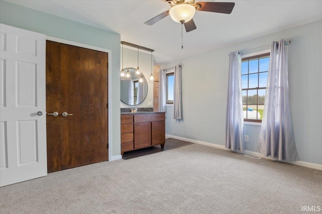 1689 E 550 Rd S, Peru, IN 46970 - unfurnished bedroom with visible vents, carpet floors, and multiple windows