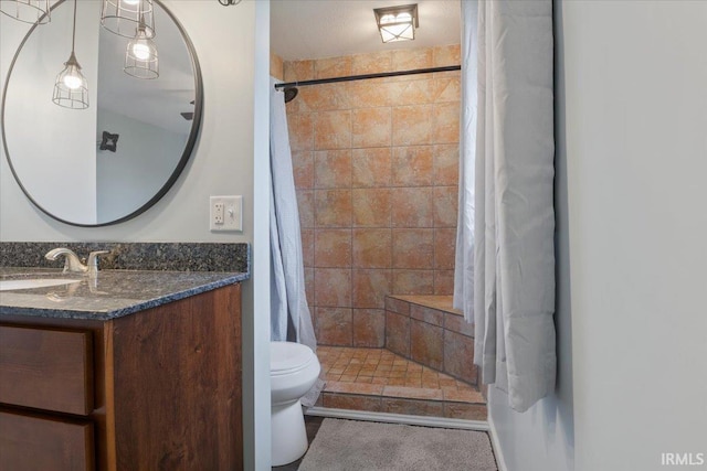 1689 E 550 Rd S, Peru, IN 46970 - bathroom featuring a tile shower, toilet, and vanity