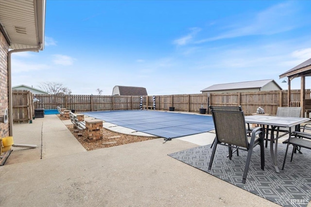 1689 E 550 Rd S, Peru, IN 46970 - view of pool featuring a patio area, a fenced backyard, a fenced in pool, and outdoor dining area