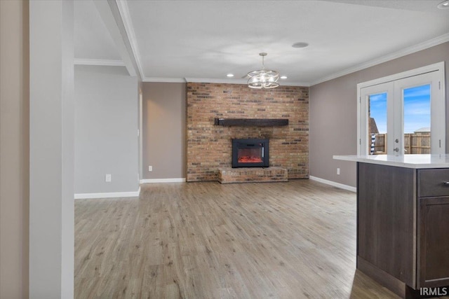 1689 E 550 Rd S, Peru, IN 46970 - unfurnished living room with a fireplace, light wood-type flooring, crown molding, and baseboards