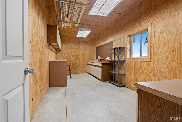 1689 E 550 Rd S, Peru, IN 46970 - interior space with wood ceiling, wood walls, and concrete floors