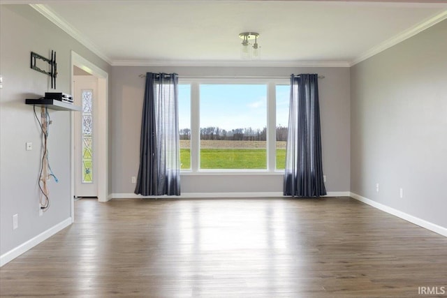 1689 E 550 Rd S, Peru, IN 46970 - unfurnished room with baseboards, wood finished floors, and ornamental molding