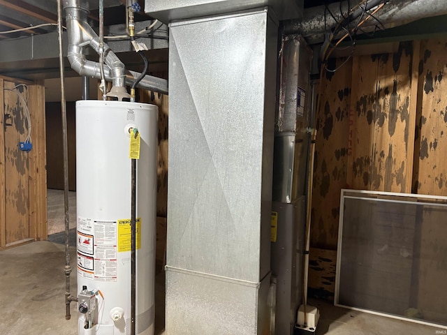 utility room featuring water heater