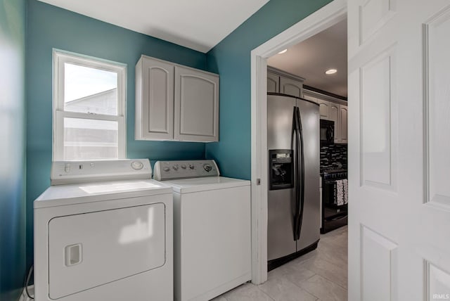 washroom with cabinet space, recessed lighting, and separate washer and dryer