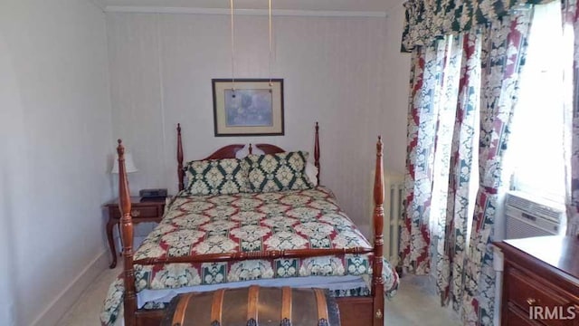 bedroom with baseboards and crown molding
