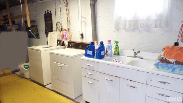 washroom featuring laundry area and separate washer and dryer