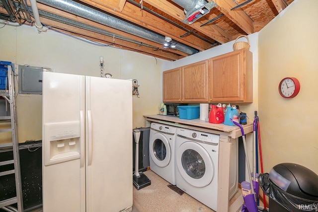 washroom with washing machine and clothes dryer and cabinet space