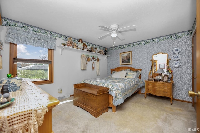 bedroom featuring wallpapered walls, ceiling fan, light carpet, baseboards, and visible vents