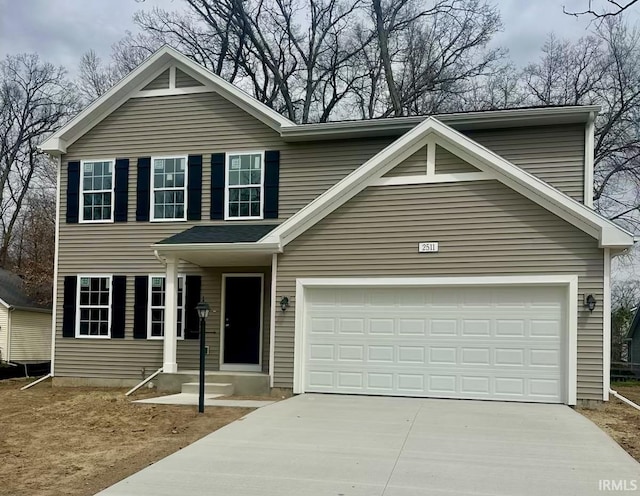 traditional-style home with a garage and driveway