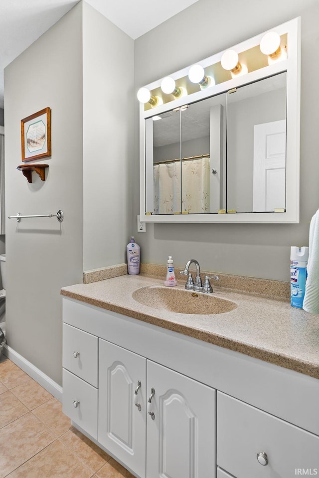 full bathroom with vanity and tile patterned flooring