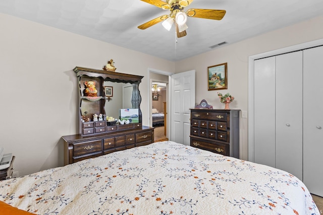 bedroom featuring a closet, visible vents, and a ceiling fan