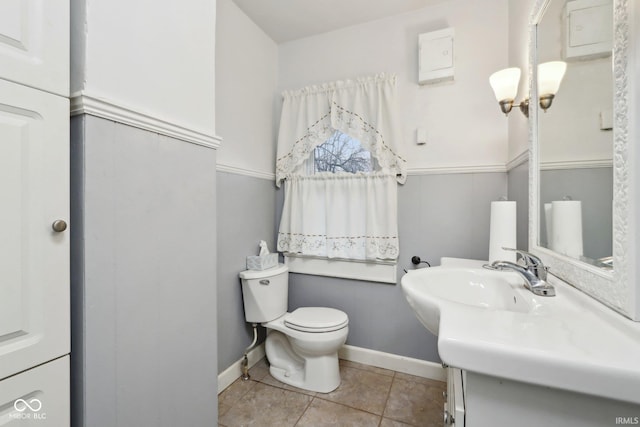1185 N 10th St, Noblesville, IN 46060 - half bathroom featuring tile patterned flooring, vanity, toilet, and baseboards