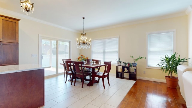 3512 Forestdale Dr, Newburgh, IN 47630 - dining area featuring baseboards, a notable chandelier, crown molding, and visible vents