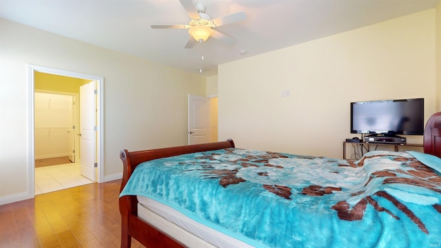 3512 Forestdale Dr, Newburgh, IN 47630 - bedroom featuring wood finished floors, a ceiling fan, baseboards, and ensuite bathroom