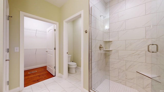 3512 Forestdale Dr, Newburgh, IN 47630 - bathroom featuring toilet, a stall shower, baseboards, visible vents, and a walk in closet
