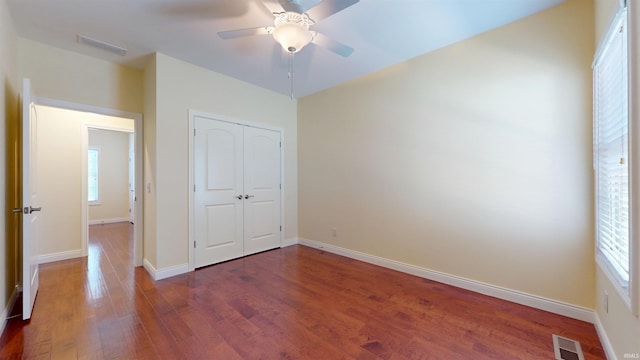 3512 Forestdale Dr, Newburgh, IN 47630 - unfurnished bedroom featuring dark wood-style floors, baseboards, and visible vents