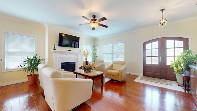 3512 Forestdale Dr, Newburgh, IN 47630 - living room featuring visible vents, ornamental molding, french doors, a fireplace, and hardwood / wood-style flooring