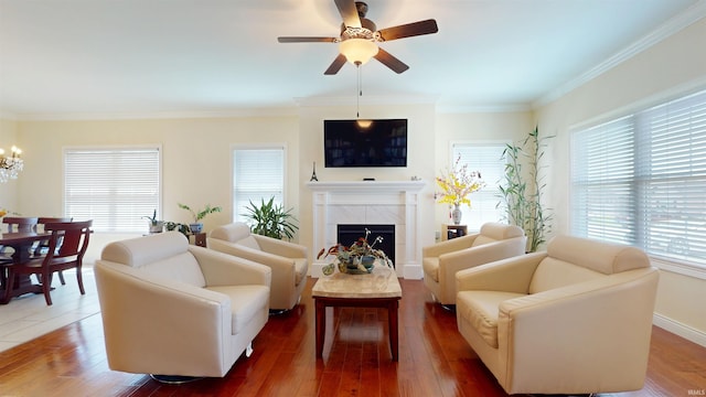 3512 Forestdale Dr, Newburgh, IN 47630 - living room with ceiling fan with notable chandelier, crown molding, wood finished floors, and a fireplace
