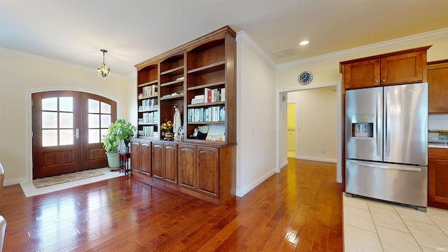 3512 Forestdale Dr, Newburgh, IN 47630 - interior space with a chandelier, stainless steel refrigerator with ice dispenser, open shelves, and ornamental molding