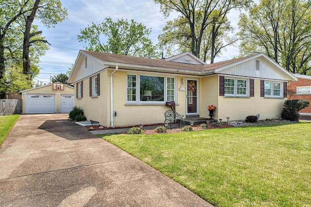 ranch-style home featuring brick siding, a detached garage, an outbuilding, and a front yard