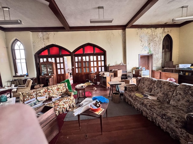 living room with french doors, wood finished floors, and beamed ceiling