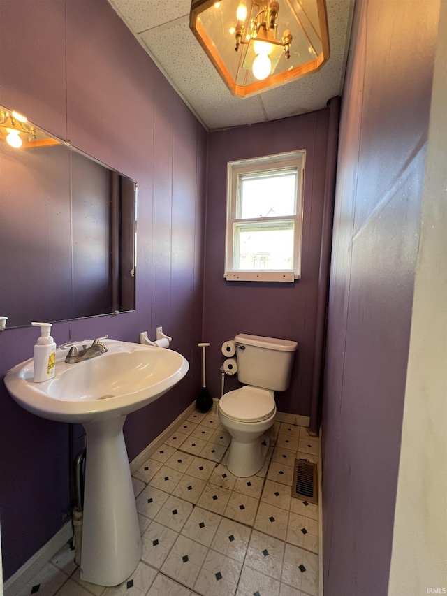 bathroom featuring visible vents and toilet