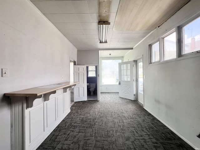 857 Byron St, Huntington, IN 46750 - hall featuring dark carpet and baseboards