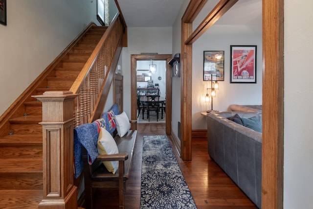 819 Columbia Ave, Fort Wayne, IN 46805 - hallway featuring baseboards, wood finished floors, and stairs