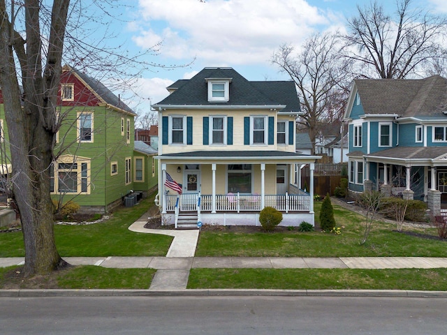 819 Columbia Ave, Fort Wayne, IN 46805 - view of front of home with central AC unit, a front lawn, and covered porch