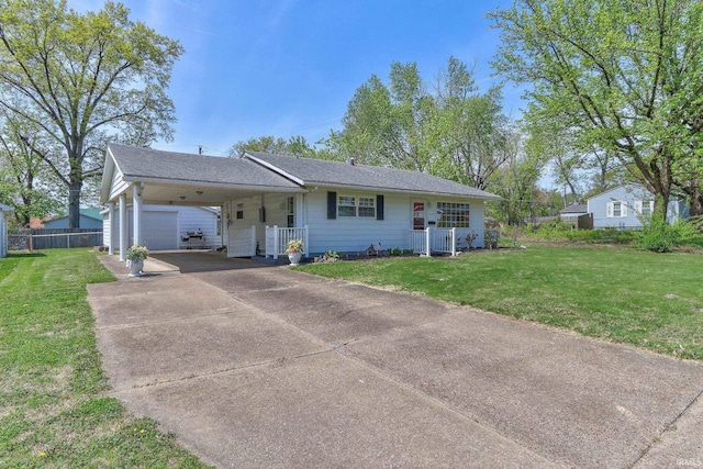 ranch-style house featuring fence, a front lawn, a carport, and concrete driveway