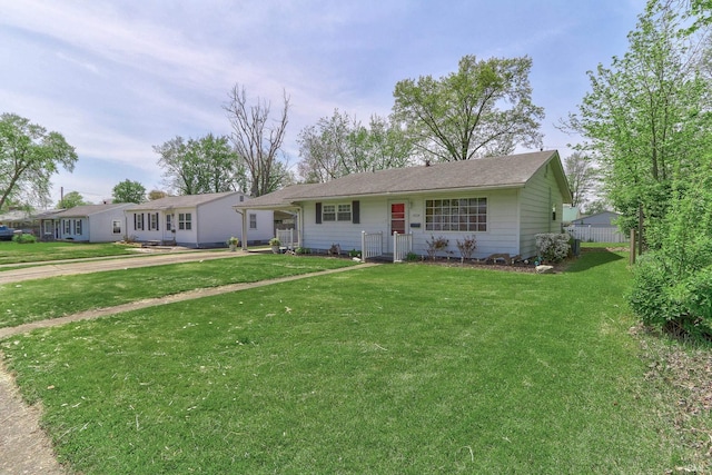 ranch-style house featuring a front lawn
