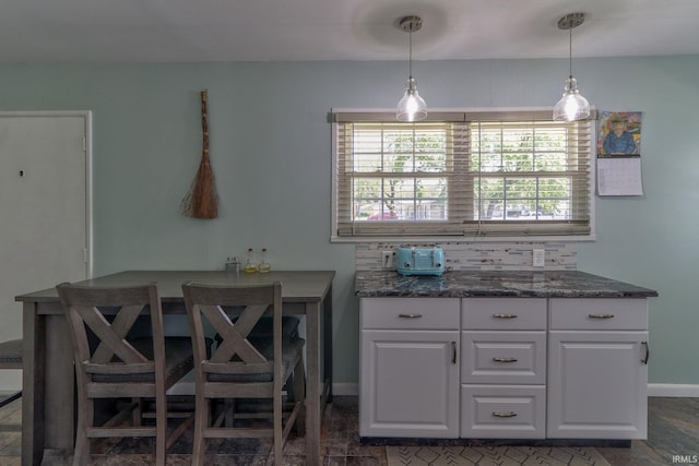 dining room featuring baseboards