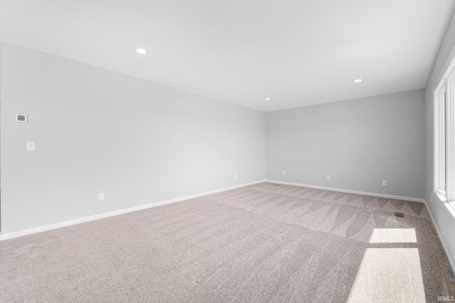 1010 Bryce Cir, Ligonier, IN 46797 - empty room featuring baseboards, recessed lighting, and light colored carpet